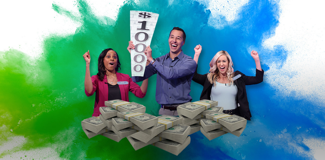 Contestant holding up a 10k wedge with a pile of money. 