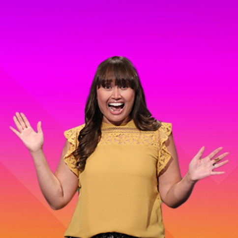 Contestant in yellow shirt smiling. 