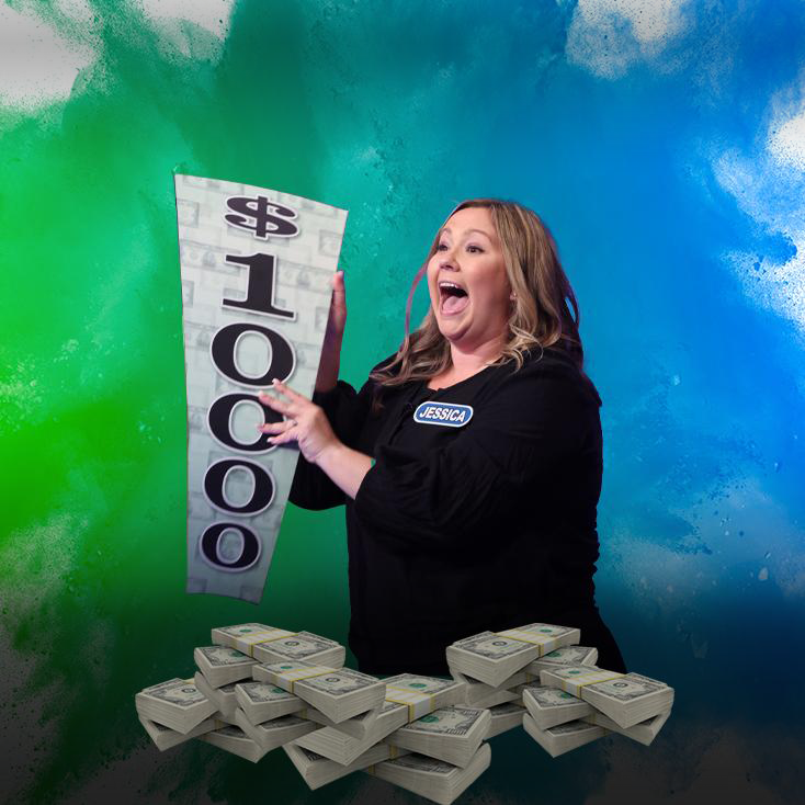 A Wheel Contestant Holding the $10,000 Mystery Wedge in front of a pile of money. 