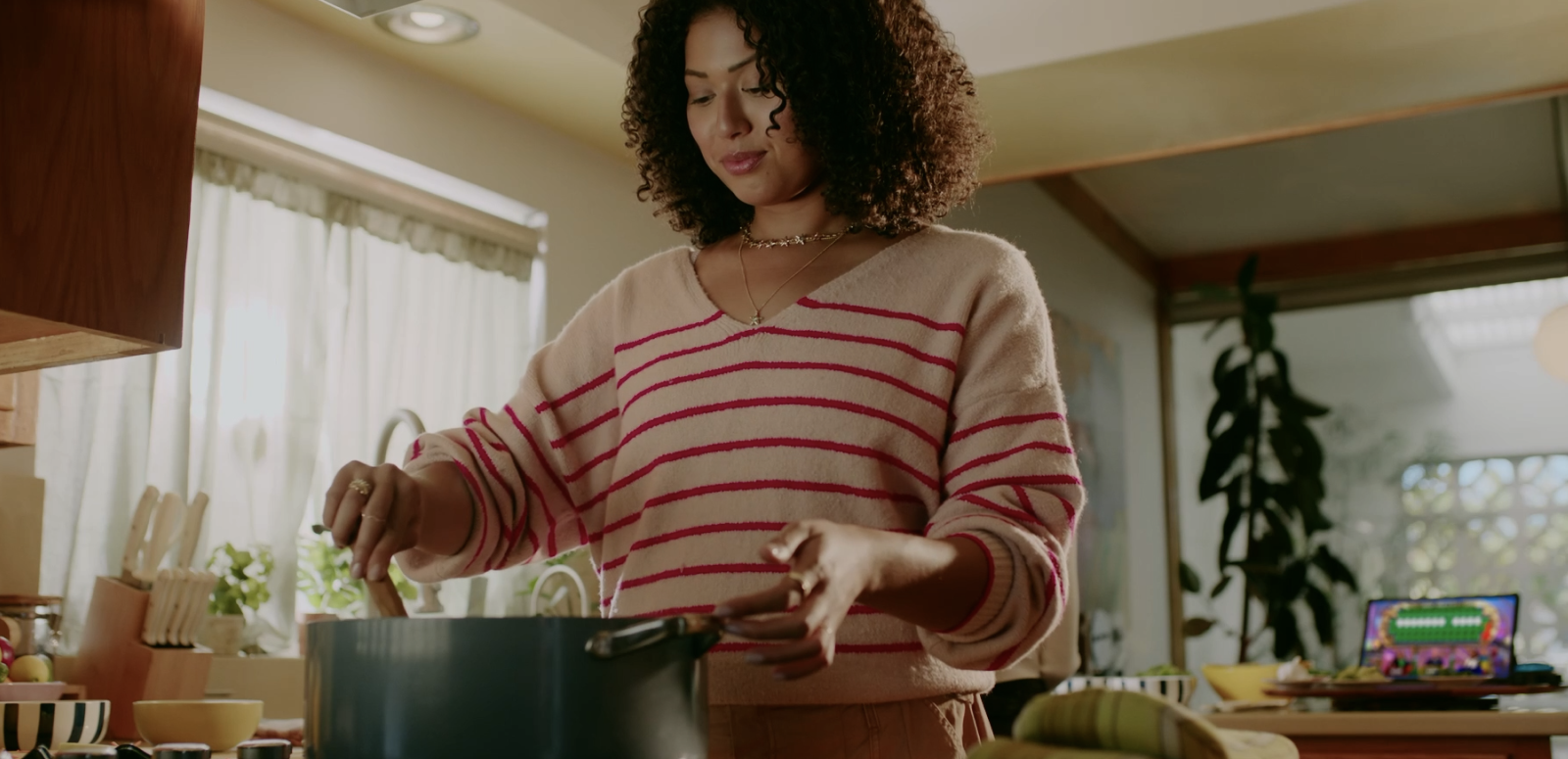 Wheel Watcher cooking and streaming Wheel on her laptop